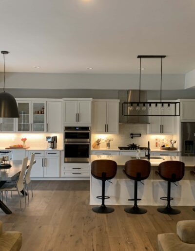 Modern kitchen with a breakfast bar and pendant lighting.